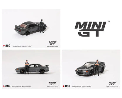 MINI GT 1:64 Nissan Skyline GT-R (R32) Nismo Gunmetal with Matsuda Figure 鈥?Tsugio Matsuda Collection