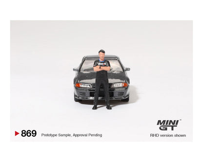 MINI GT 1:64 Nissan Skyline GT-R (R32) Nismo Gunmetal with Matsuda Figure 鈥?Tsugio Matsuda Collection